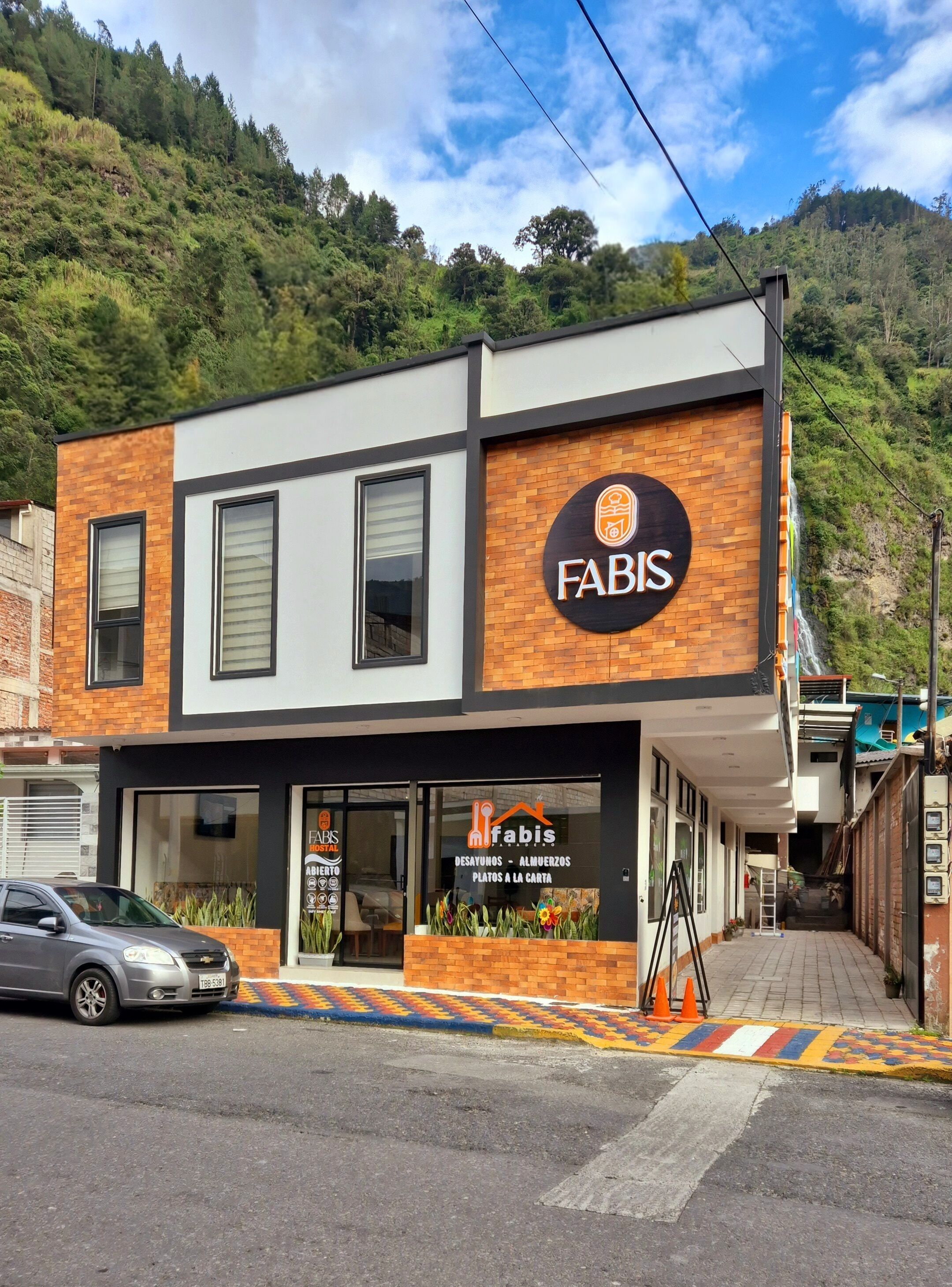 A two-story building with a sign reading 'FABIS' on the facade.