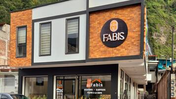 A two-story building with a sign reading 'FABIS' on the facade.