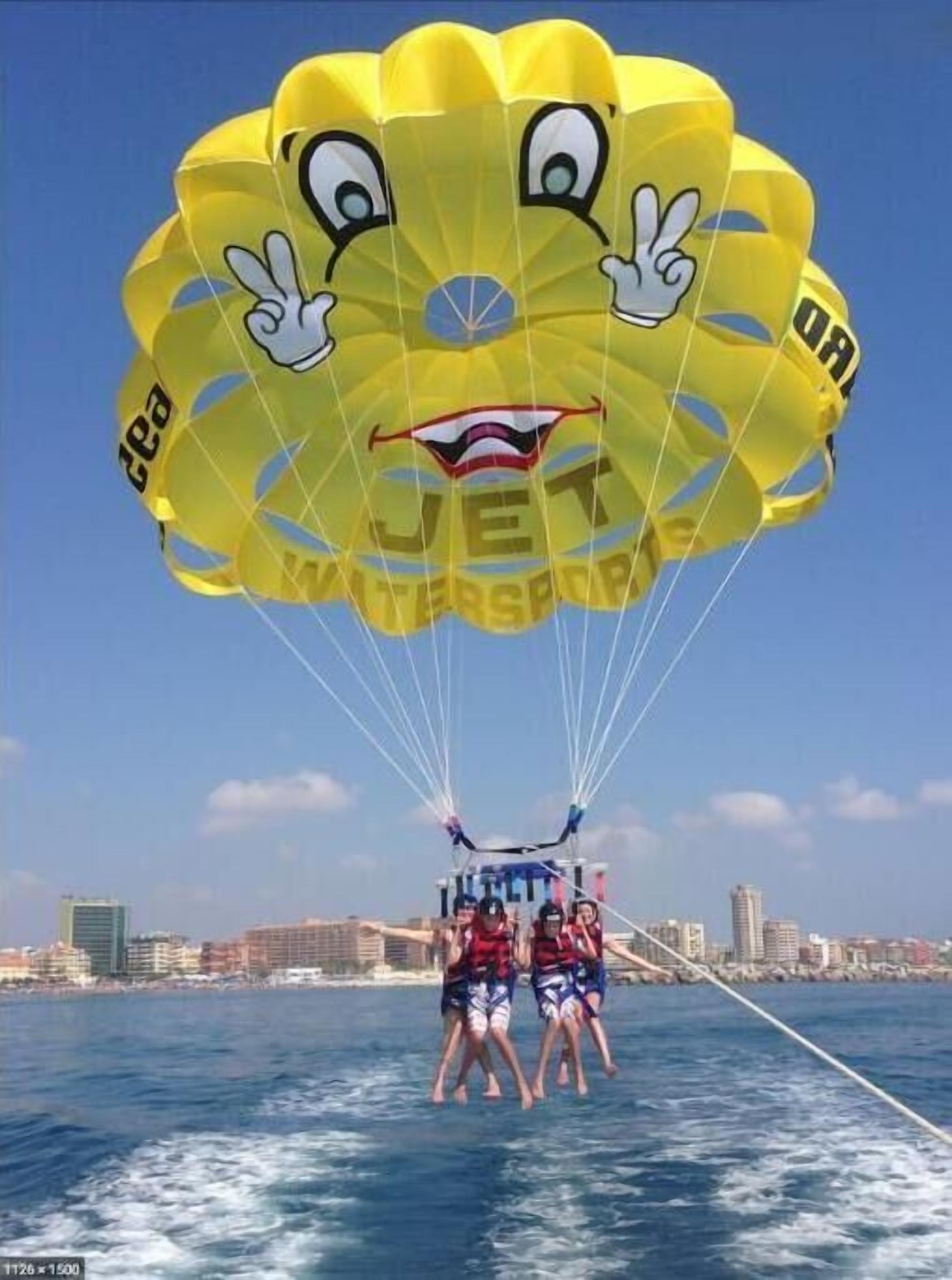 A parasail with a cartoon face and the word "JET" on it.