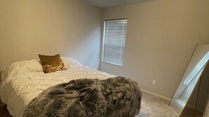 A bedroom with a bed, a window with blinds, a ceiling light, and a carpeted floor. - Like New Home close to town family friendly, quiet and close to amenities.  (Conway)
