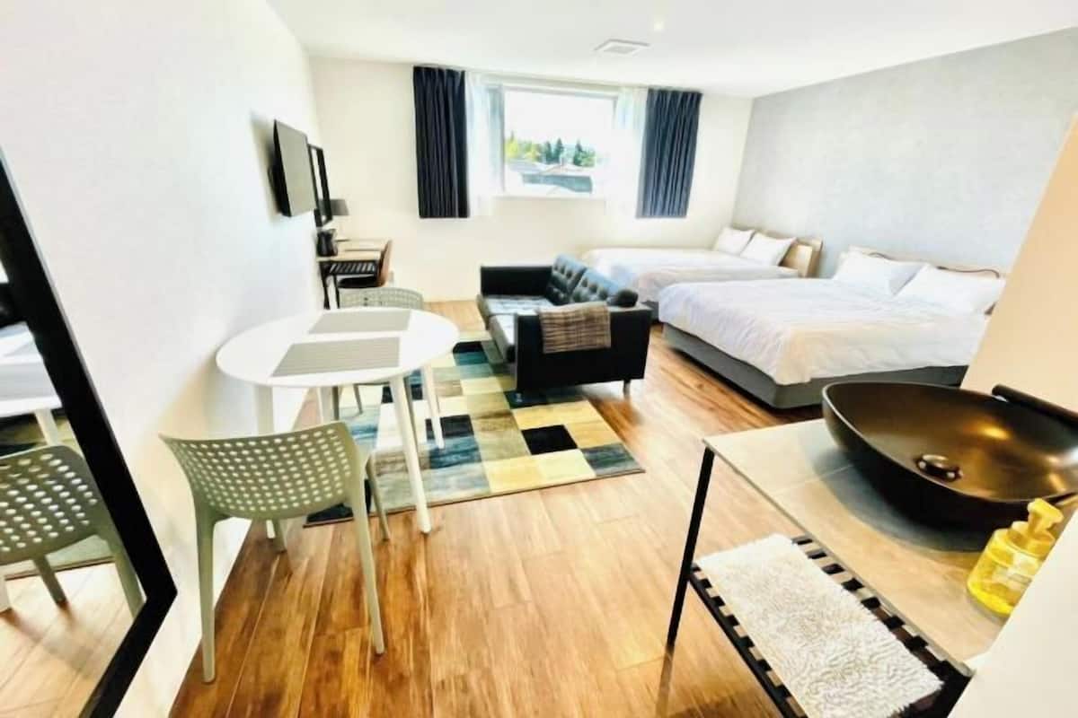 Premium bedding, desk, laptop workspace, soundproofing