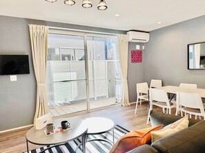 Basic Villa, Non Smoking | Living area | 32-inch flat-screen TV with digital channels