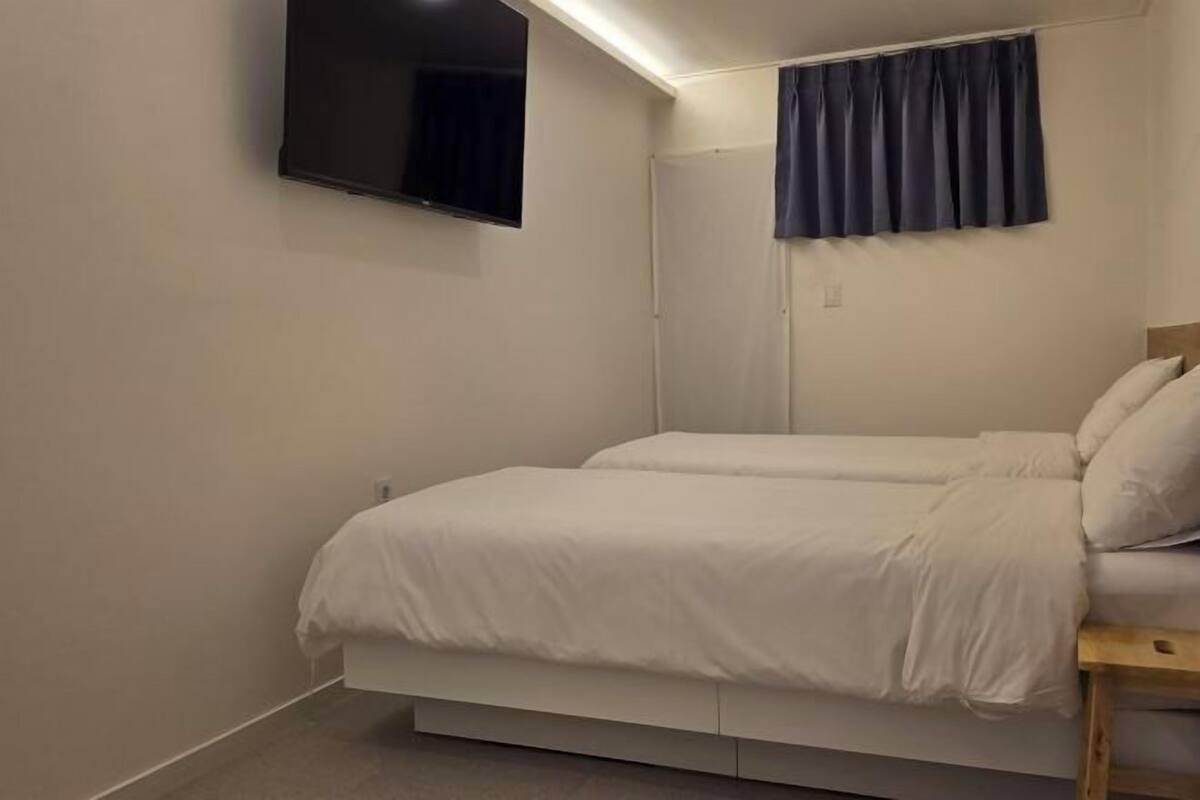 Desk, laptop workspace, free WiFi, bed sheets