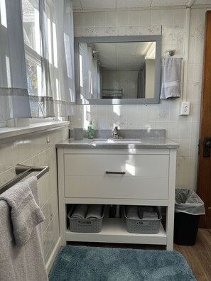 Shower, towels, soap, toilet paper