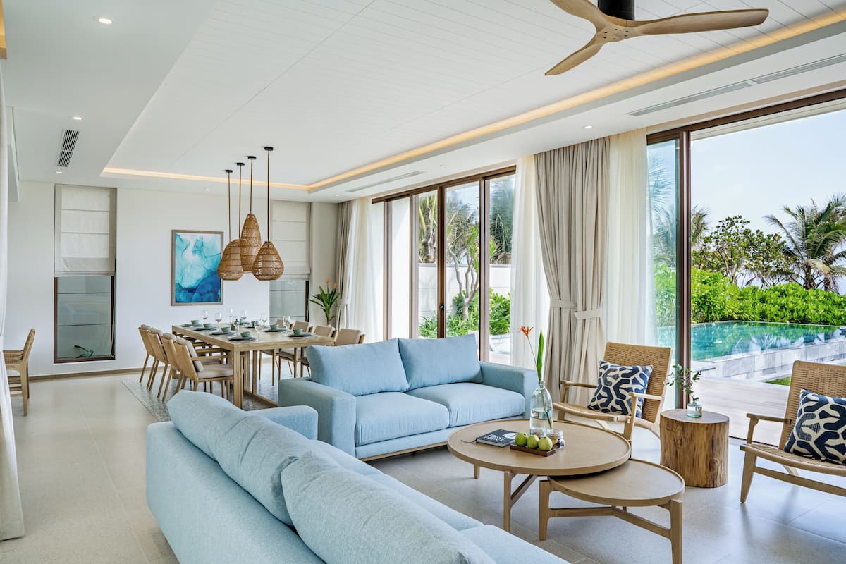 Four-bedroom Beachfront Pool Villa | Living area | Flat-screen TV, fireplace
