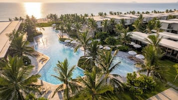 On the beach, white sand, sun loungers, beach umbrellas