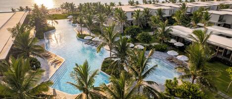 On the beach, white sand, sun loungers, beach umbrellas
