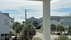 A residential area with houses, palm trees, and a clear sky. - Sea For Yourself - 1/2 Block to Ocean in Surfside Beach (Surfside Beach)