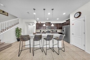 Fridge, microwave, oven, stovetop - 2027 - Serenity Bliss at Windsor Westside: 5-Bed Oasis of Tranquility and Elegance (Orlando)