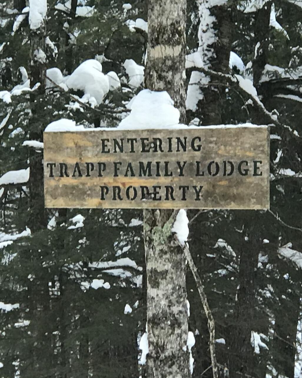 A sign indicating the entrance to Trapp Family Lodge property.