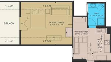 A floor plan with a balcony, a living room, a kitchen, and a bathroom.