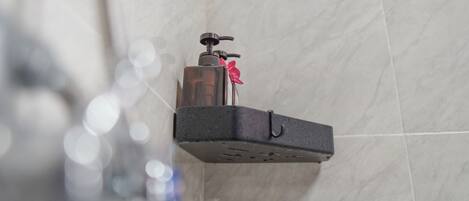 A bathroom with a mounted sink and a towel rack.