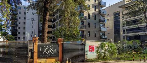 A gated entrance with a sign for 'The Kika Muthangari, Nairobi.'