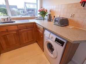 Fridge, electric kettle, toaster, cookware/dishes/utensils