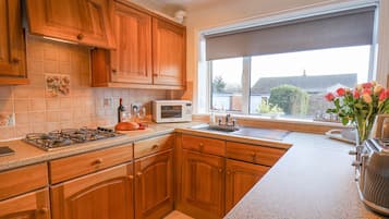 Fridge, electric kettle, toaster, cookware/dishes/utensils