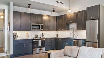 Luxury Suite, 2 Bedrooms | Private kitchen | Fridge, microwave, oven, stovetop