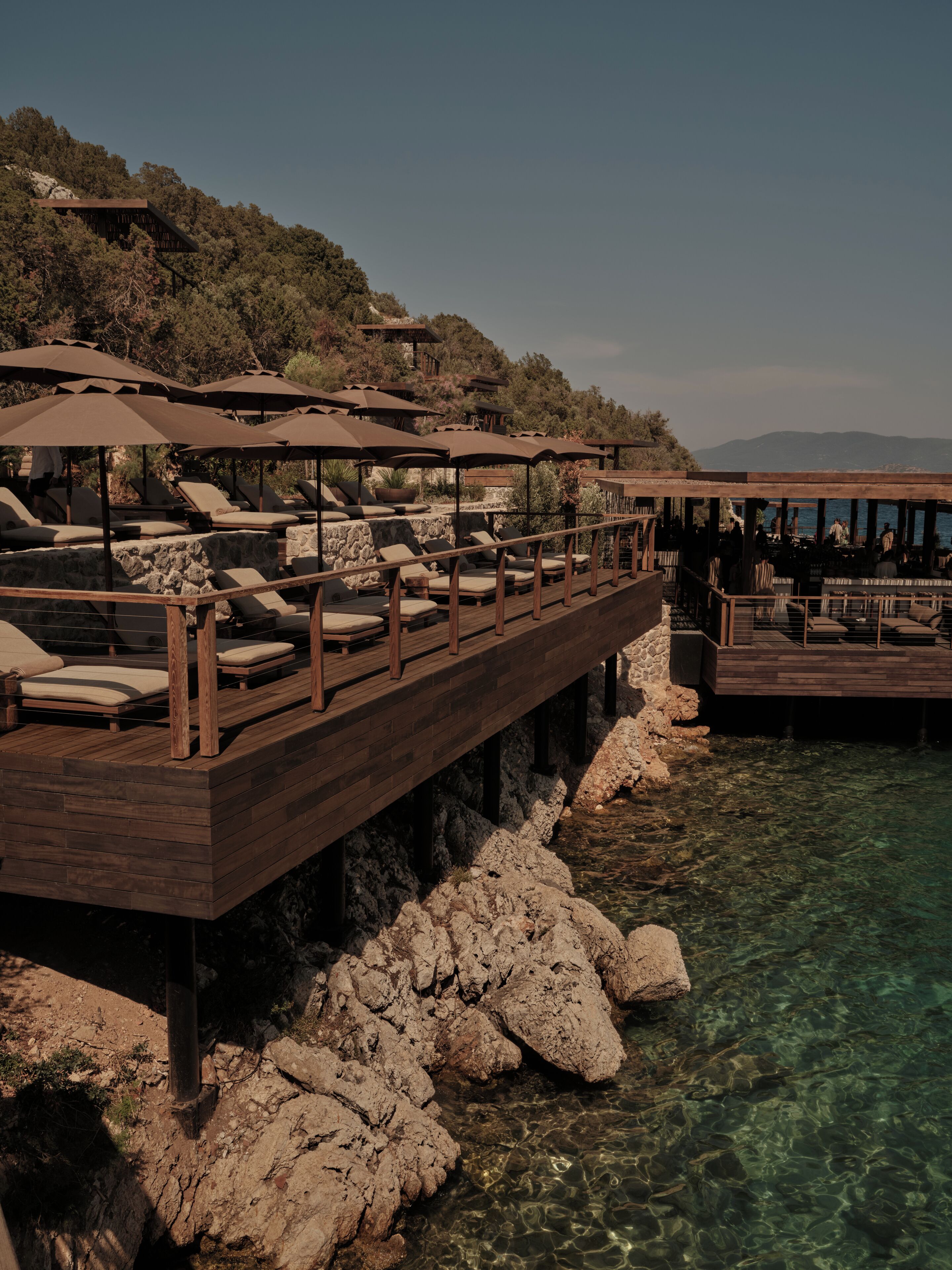 On the beach, white sand, beach cabanas, sun-loungers