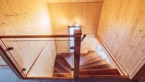 A wooden staircase with glass railings inside a room with wooden walls. - Woody 1 - near ski resort at unique location (St. Georgen am Kreischberg)