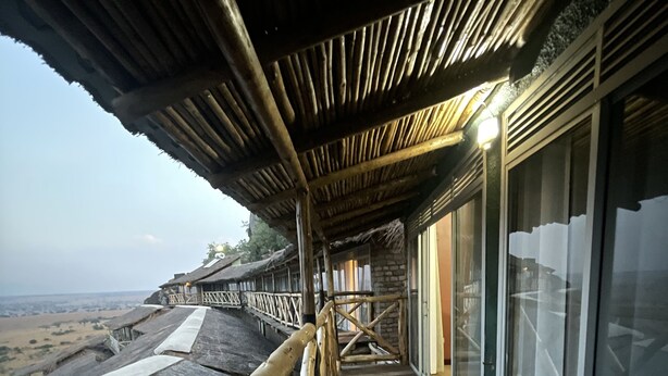 A wooden deck with a railing, overlooking a scenic landscape. - Katurum Lodge Kidepo  (Loitanit)