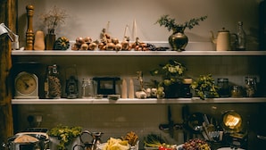 A kitchen with various food items and kitchenware on shelves and countertops. - The Dell of Abernethy (Nethy Bridge)