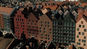A densely packed urban area with a variety of building styles, including modern and traditional architecture. - The Cloud One Gdansk (Gdansk)