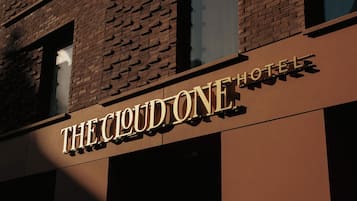 A hotel sign with the name "The Cloud One".