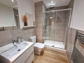 Shower, hair dryer, towels, soap