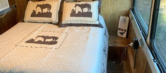 Renovated coach bus overlooking equestrian and plantation properties. 