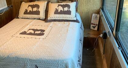 Renovated coach bus overlooking equestrian and plantation properties.