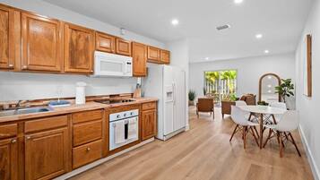 Fridge, stovetop, coffee/tea maker, cookware/dishes/utensils