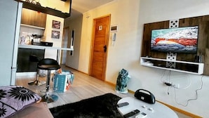 Family Apartment (A) | Living area | Flat-screen TV