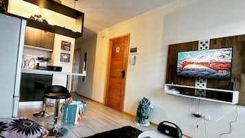 Family Apartment (A) | Living area | Flat-screen TV