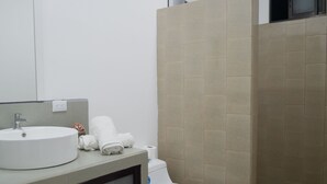 A modern bathroom with a round sink, toilet, and shower area. - Apartment Pinilla With 2 Room, Kitch, a/c (Pinilla)