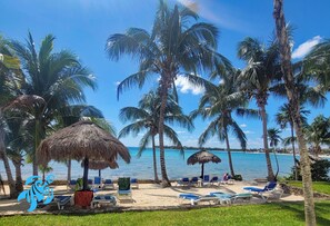 On the beach, sun-loungers, beach towels