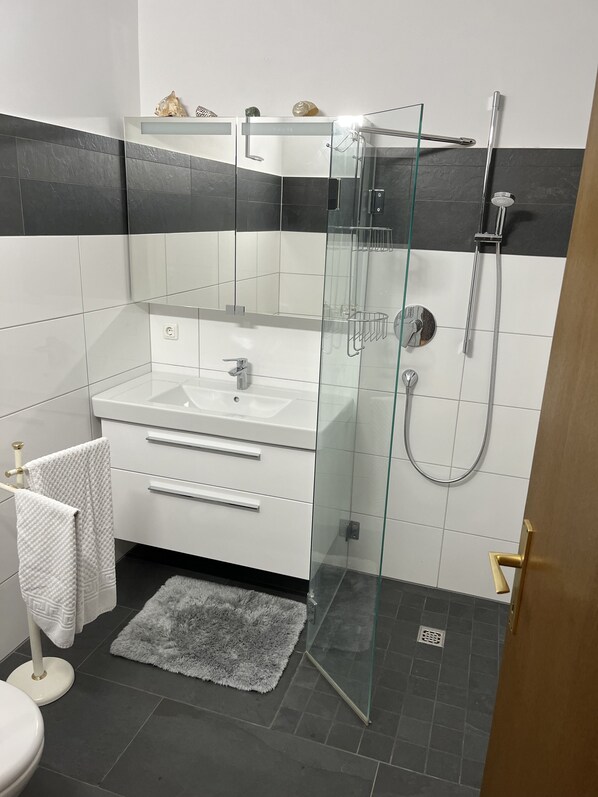 Shower, towels, soap, shampoo