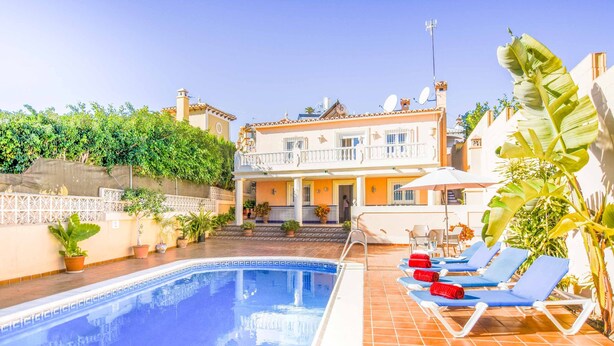 A swimming pool with lounge chairs and potted plants. - Villa Nerja Angeles - Three Bedroom Villa, Sleeps 6 (Nerja)