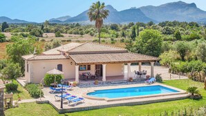A house with a swimming pool, patio furniture, and a view of mountains. - Villa Vobis - Three Bedroom Villa, Sleeps 6 (Mallorca)