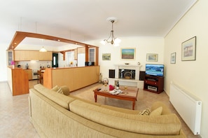 Luxury Apartment, 3 Bedrooms | Living area | 65-inch flat-screen TV with satellite channels, DVD player, MP3 dock - Faos Luxury Apartments 2 (Kefalonia)