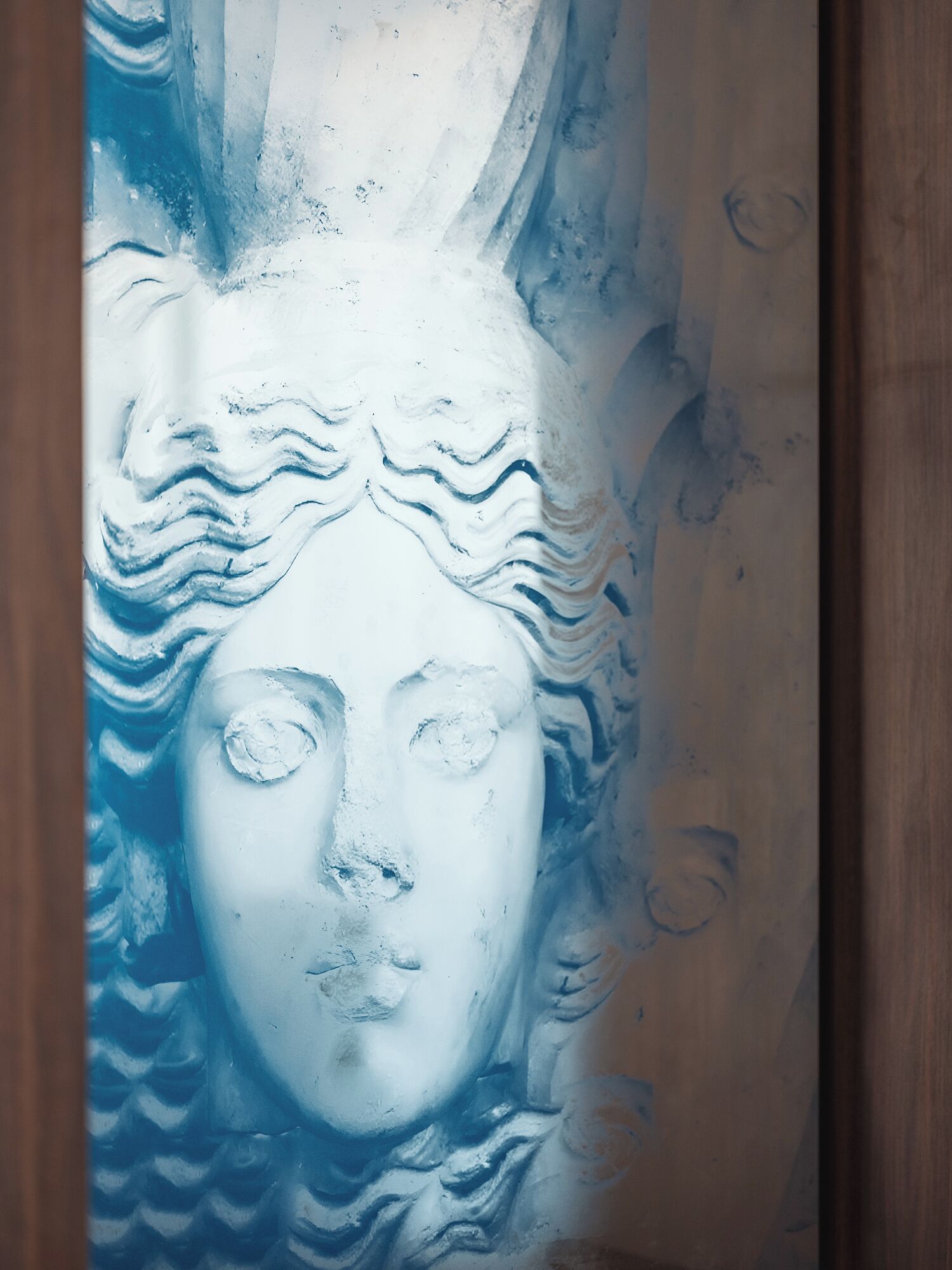 A sculpture with a wavy pattern on its surface.