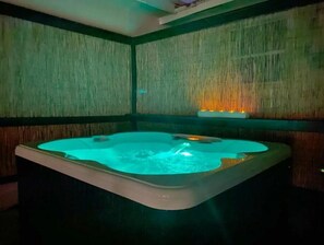 Relax in a cozy hot tub amidst a natural, earthy ambiance.