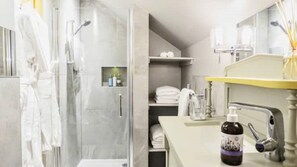 Shower, eco-friendly toiletries, hair dryer, towels
