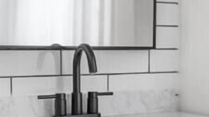A modern kitchen with a black faucet, white tiles, and wooden cabinetry. - Lawless Rico: Enterprise Suite (Rico)
