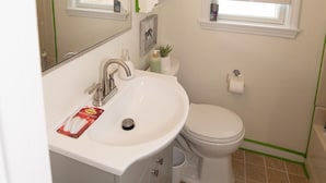 A bathroom with a white sink, mirror, and toilet. - NEW LISTING!!! Cedar Shade Beach Retreat (Lower Township)