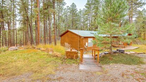 A cabin with a wooden deck leading to the entrance, surrounded by a forest. - Bayfield Retreat, 9 Mi to Vallecito Reservoir! (Bayfield)