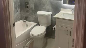Separate tub and shower, deep soaking tub, towels