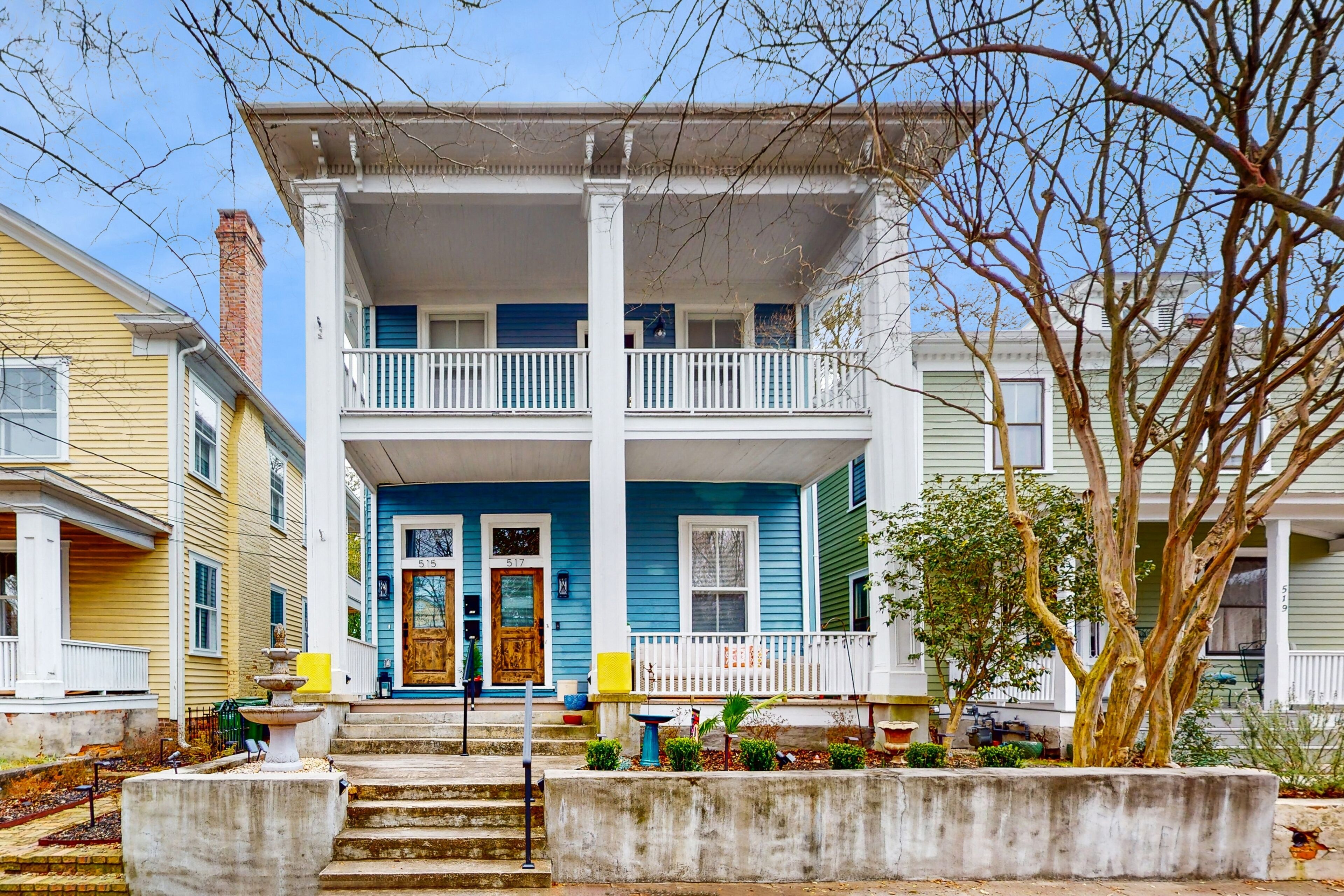 Dog-friendly duplex with a fenced yard, furnished balcony, & washer/dryer