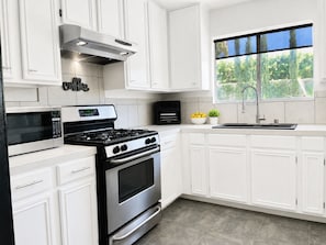 Coffee/tea maker, fridge, microwave, oven