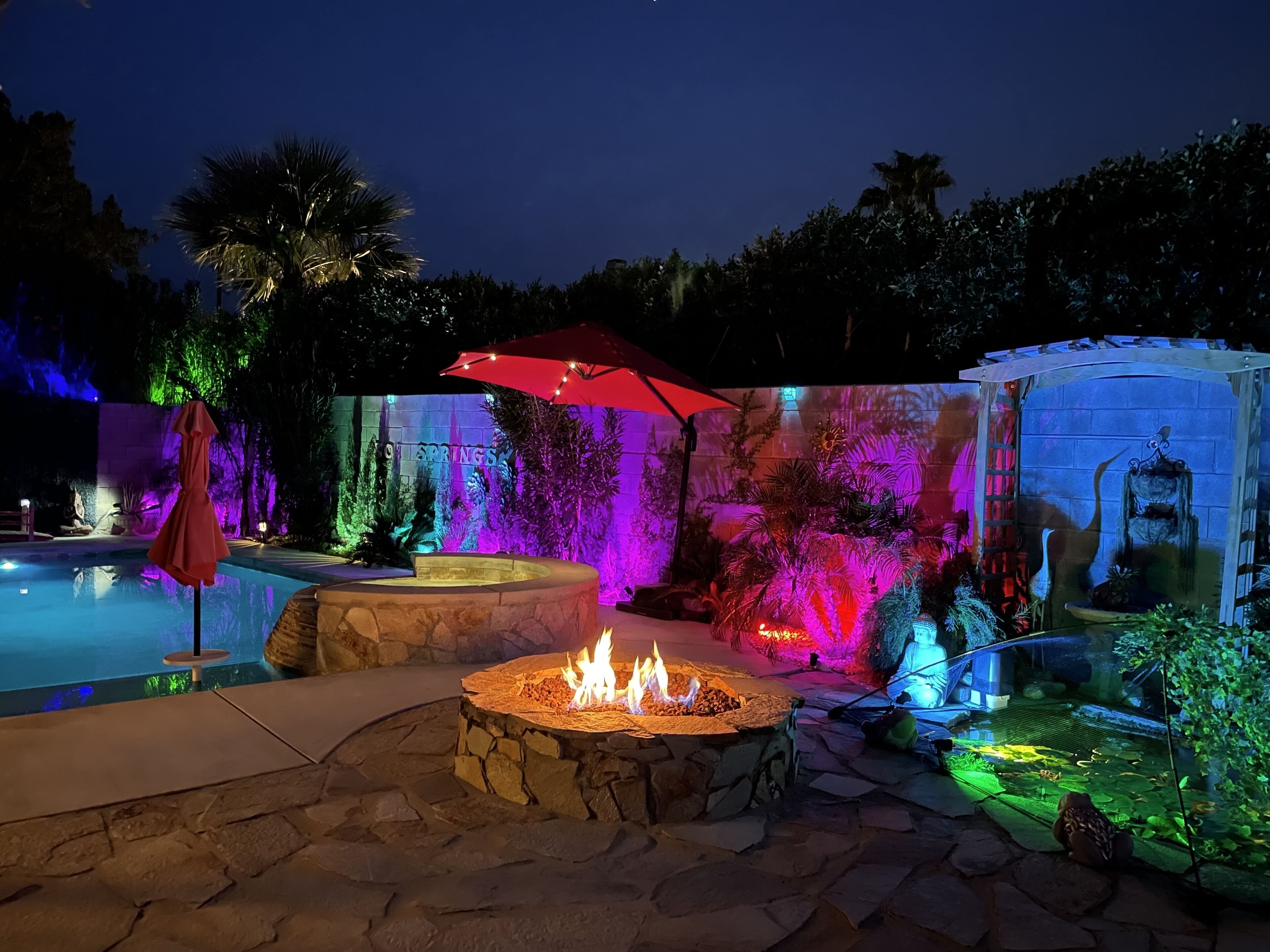 Oversized heated mineral saltwater pool & spa, koi pond, gas fire-pit at night