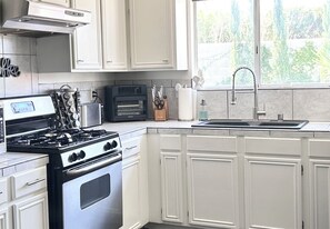 Fridge, microwave, oven, stovetop - Koi Springs Luxury Oasis | Heated Mineral Saltwater Pool, Free Spa Heat & Views (Desert Hot Springs)