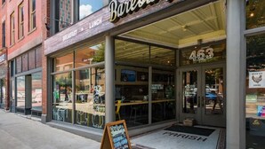 A storefront with a sign reading "Bareburger" and a number "463" on the door. - THE SKYSCRAPER IN HEART OF COLUMBUS (Columbus)